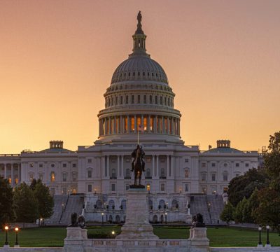 Panoramic image of the Capitol of the United States with the capitol reflecting pool Panoramic image of the Capitol of the United States with the capitol reflecting pool in morning light.