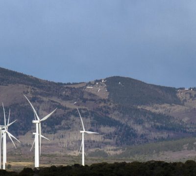 Panorama of a wind farm between Monticello and Moab Utah, with mountains in the background